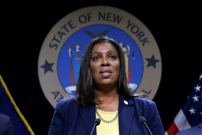 New York Attorney General Letitia James standing at a podium at a 2019 press conference.